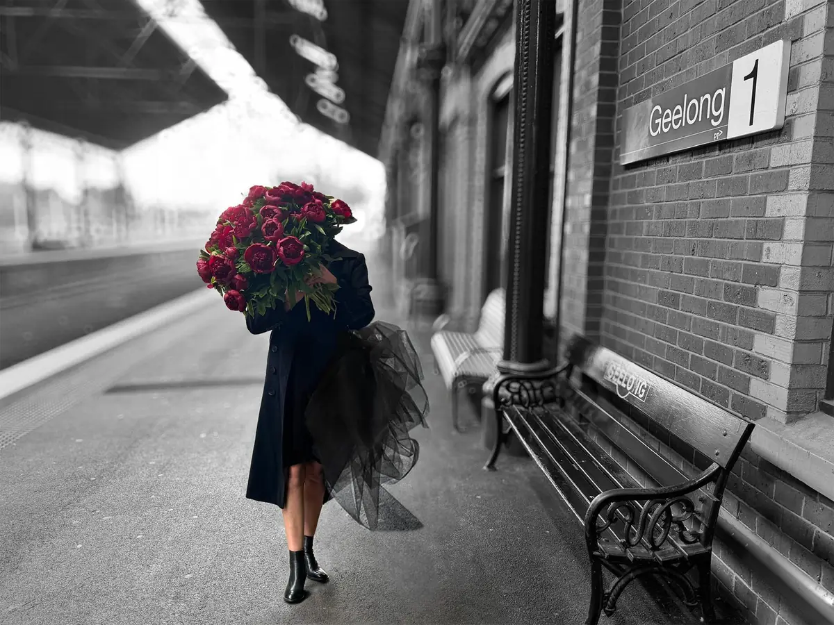 Zoe McMahon at Geelong station with an armful of peonies